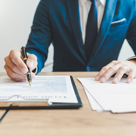 Man Writing Legal Documents