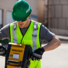 construction worker using a jackhammer while wearing NRR 27 ear plugs