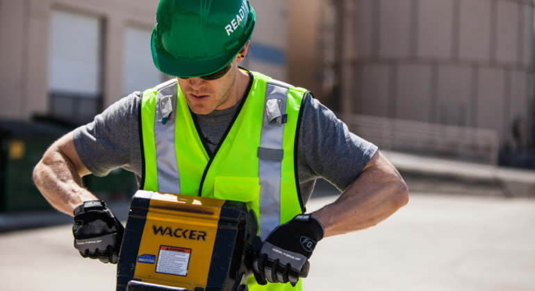 construction worker using a jackhammer while wearing NRR 27 ear plugs